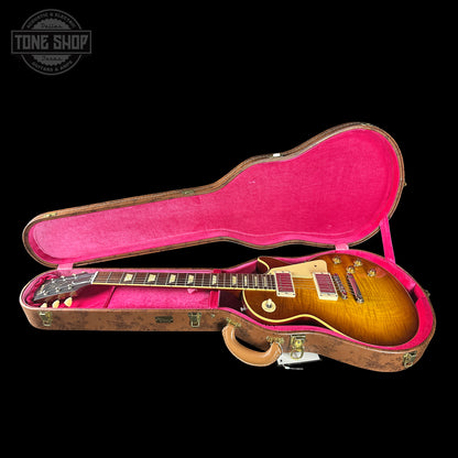 Gibson Les Paul guitar in a pink-lined case with 'Tone Shop' logo.