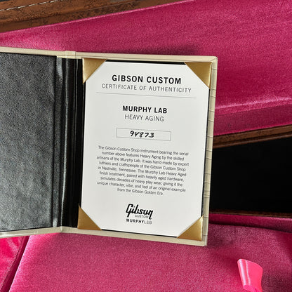 Gibson Custom Certificate of Authenticity on a pink surface