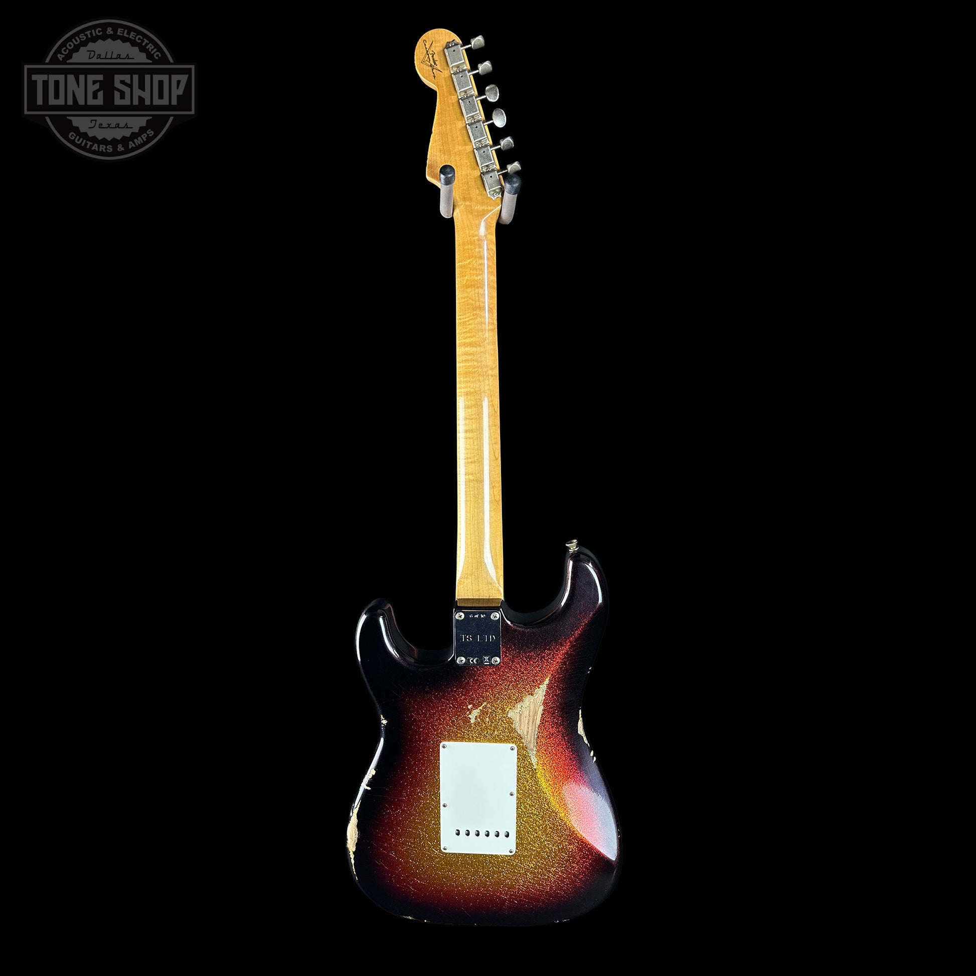 Electric guitar with a sunburst finish on a black background, featuring the Tone Shop logo.