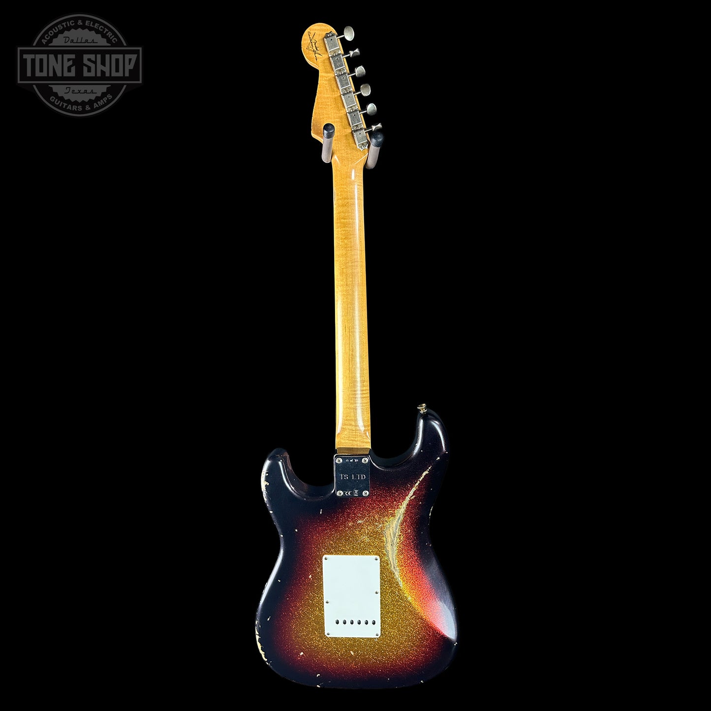 Electric guitar with a sunburst finish on a black background, featuring the Tone Shop logo.