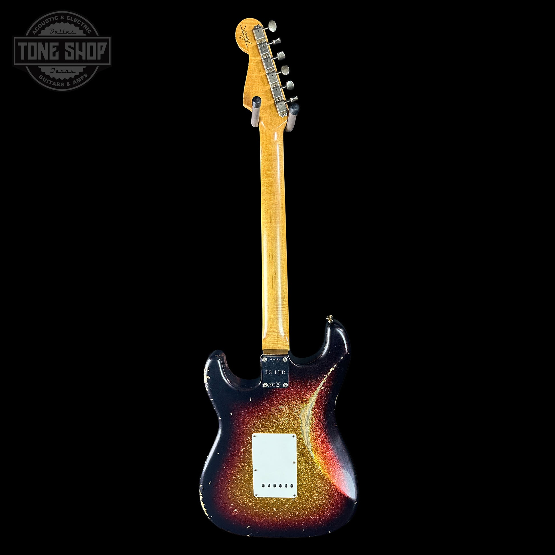 Electric guitar with a sunburst finish on a black background, featuring the Tone Shop logo.