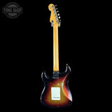 Electric guitar with a sunburst finish on a black background, featuring the Tone Shop logo.