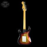 Electric guitar with a sunburst finish on a black background, featuring the Tone Shop logo.