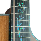 Close-up of a guitar's fretboard with decorative inlay on a white background