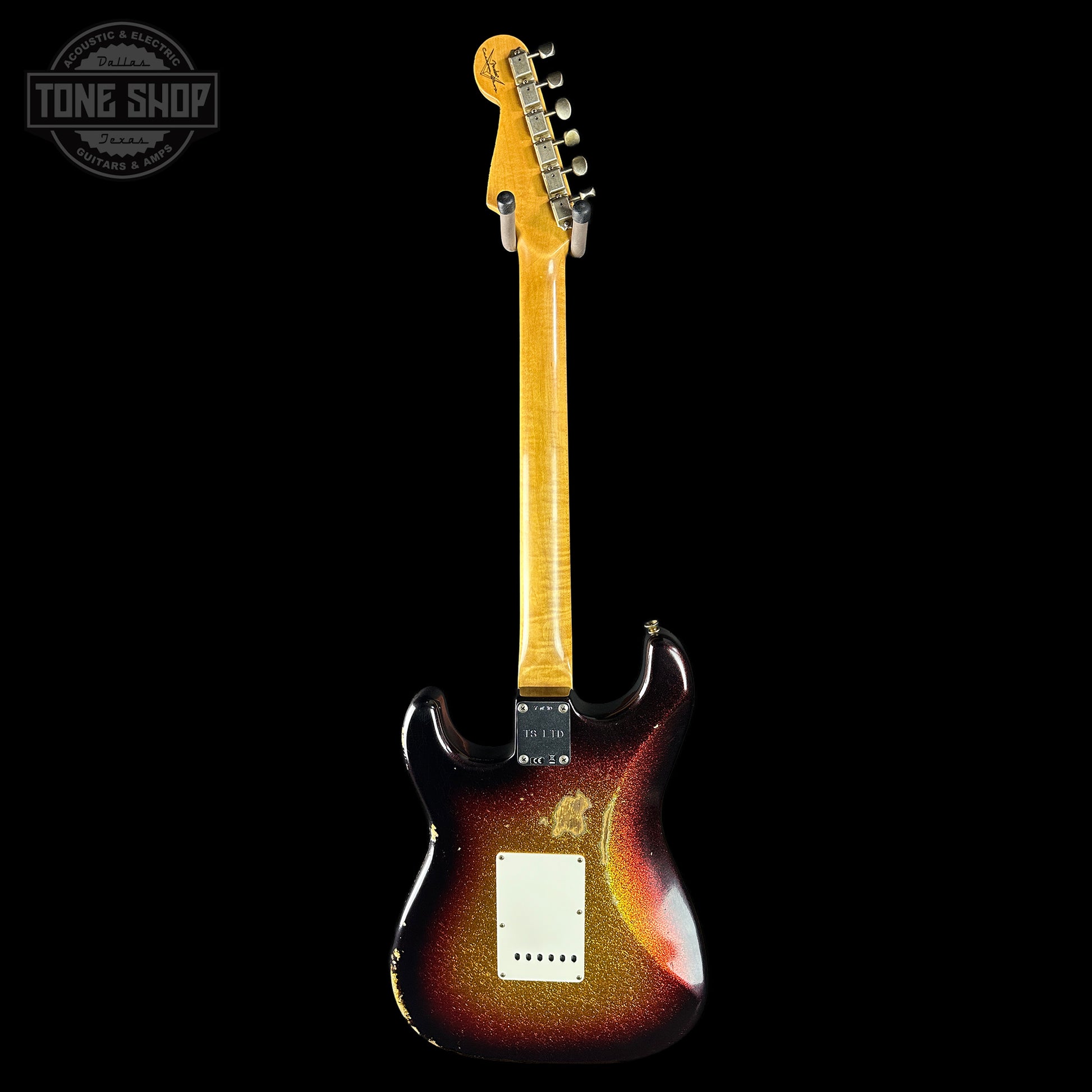 Electric guitar with a sunburst finish on a black background, featuring the Tone Shop logo.