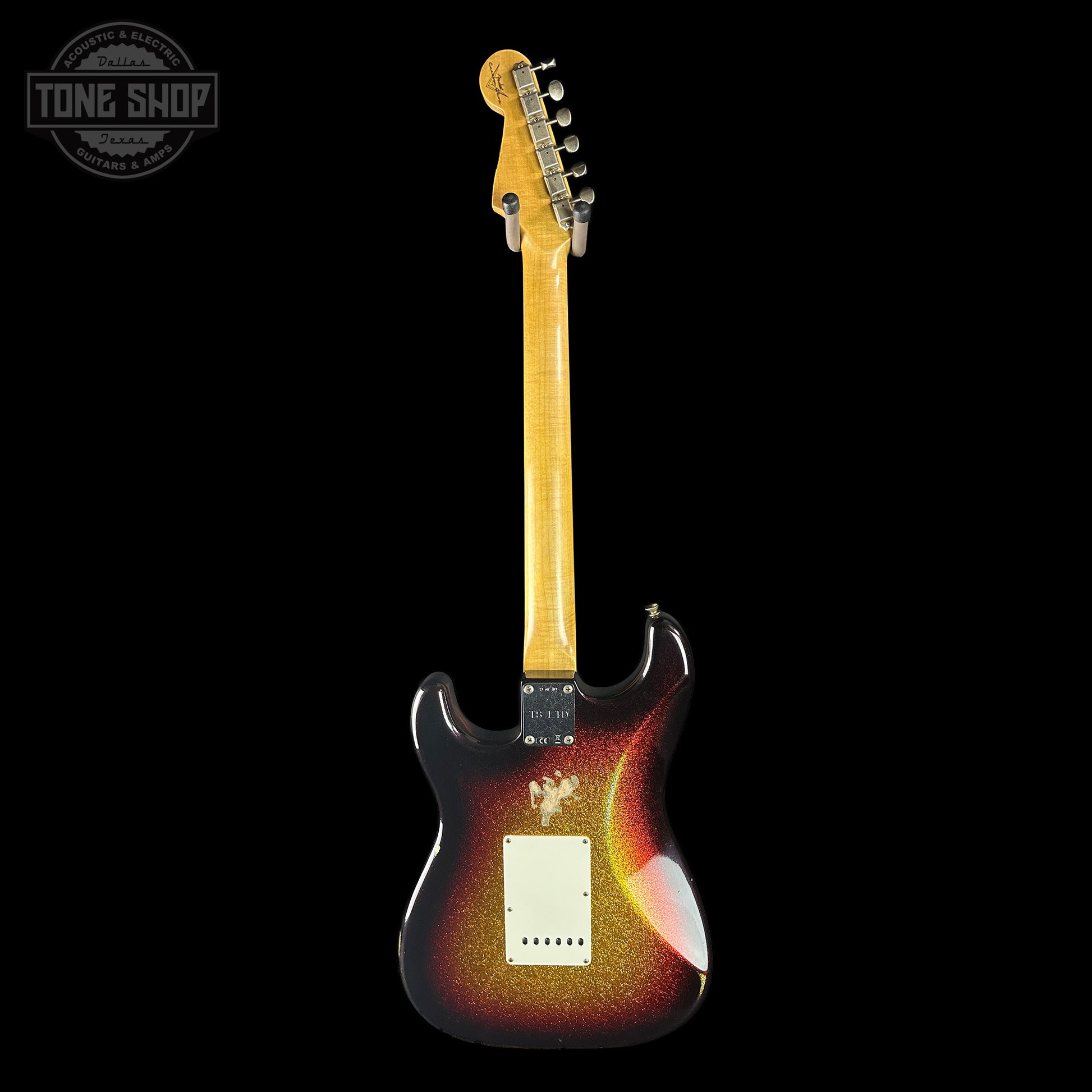Electric guitar with a sunburst finish on a black background, featuring the Tone Shop logo.