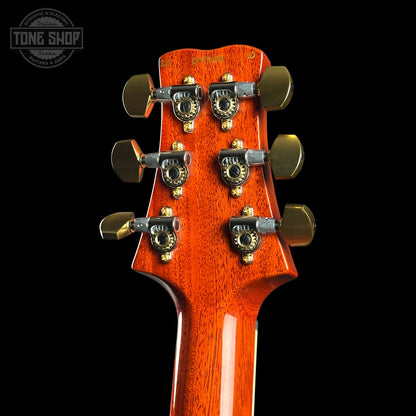 Guitar headstock with tuning pegs on a black background, featuring 'Tone Shop' logo.