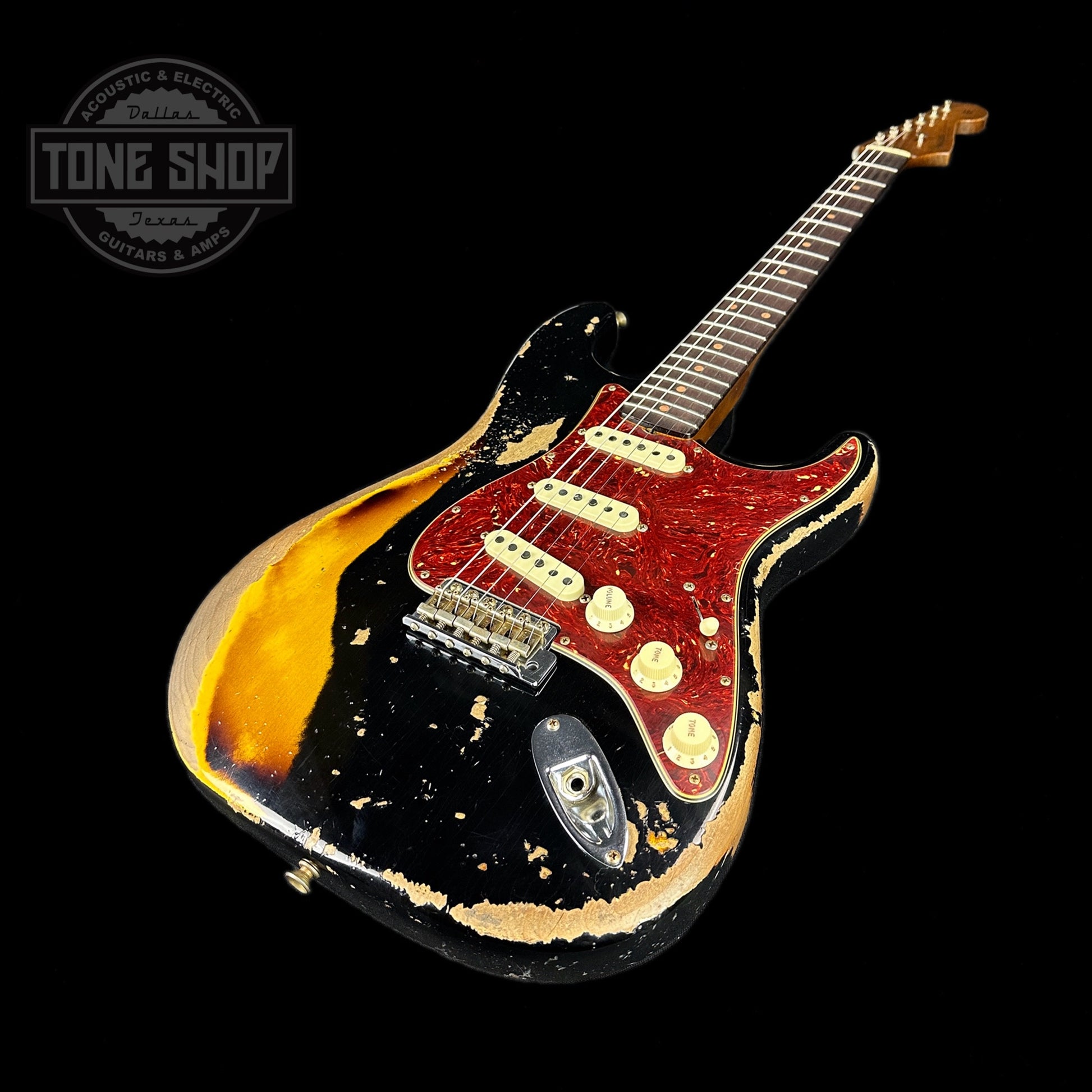 Front angle of Fender Custom Shop Limited Edition Roasted '60 Strat Super Heavy Relic Aged Black Over 3 Color Sunburst.