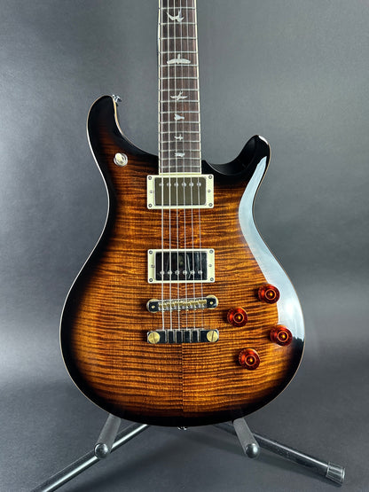 Front of body of Used PRS SE McCarty Black Gold Burst.