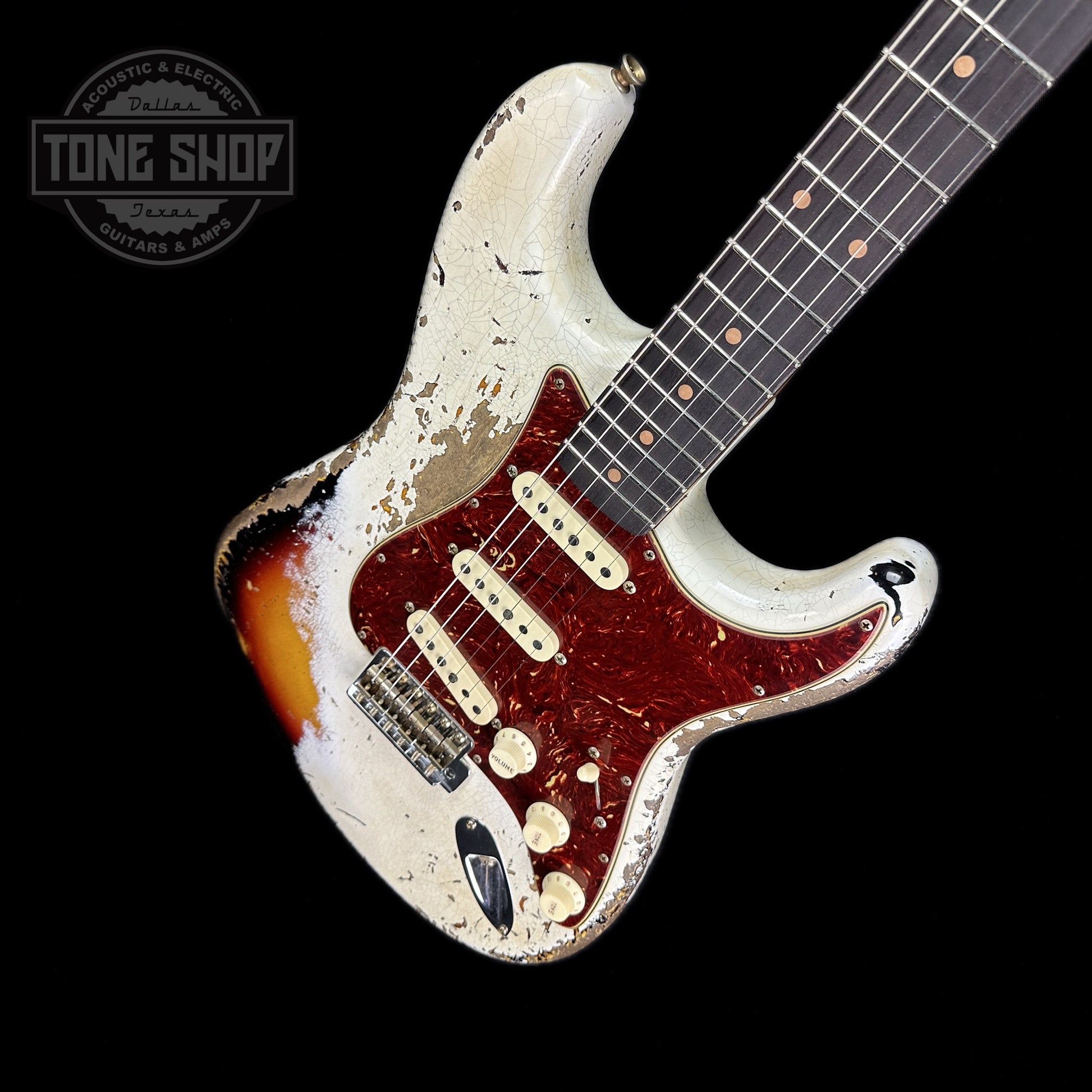 Front angle of Fender Custom Shop Limited Edition Roasted '60 Strat Super Heavy Relic Aged Olympic White Over 3 Color Sunburst.