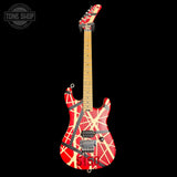 Electric guitar with red and yellow design on a black background, featuring 'Tone Shop' logo.