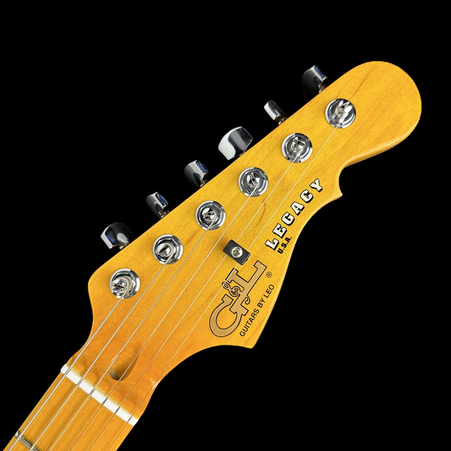 Front of headstock of Used G&L USA Legacy MN Honeyburst.