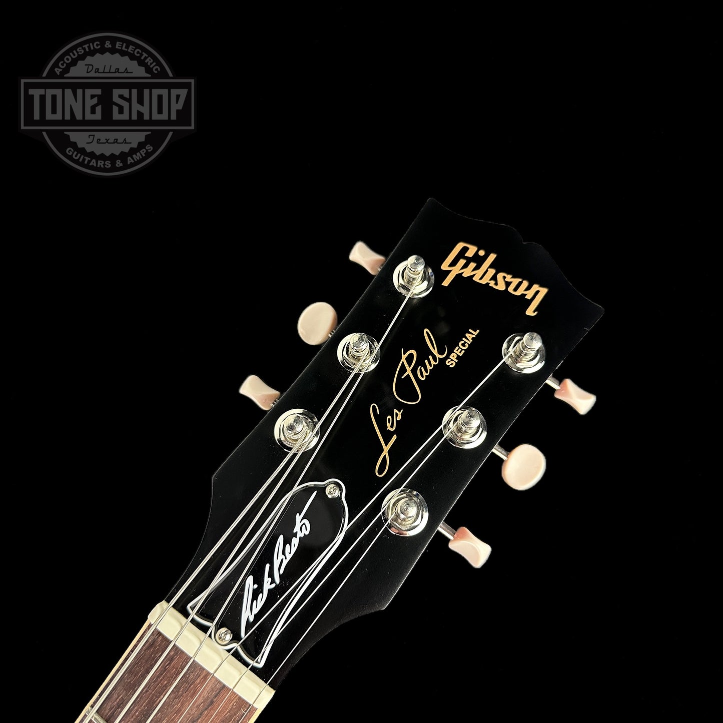 Front of headstock of Gibson Les Paul Special Double Cutaway Limited Edition Rick Beato Signature Sparkling Burgandy Satin.
