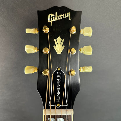 Front of headstock of Used 2022 Gibson 1960 Hummingbird Cherry Sunburst.