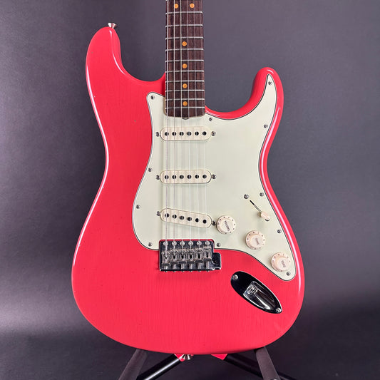 Front of Used Fender Custom Shop Ltd 64 Stratocaster Journeyman Relic Fiesta Red.