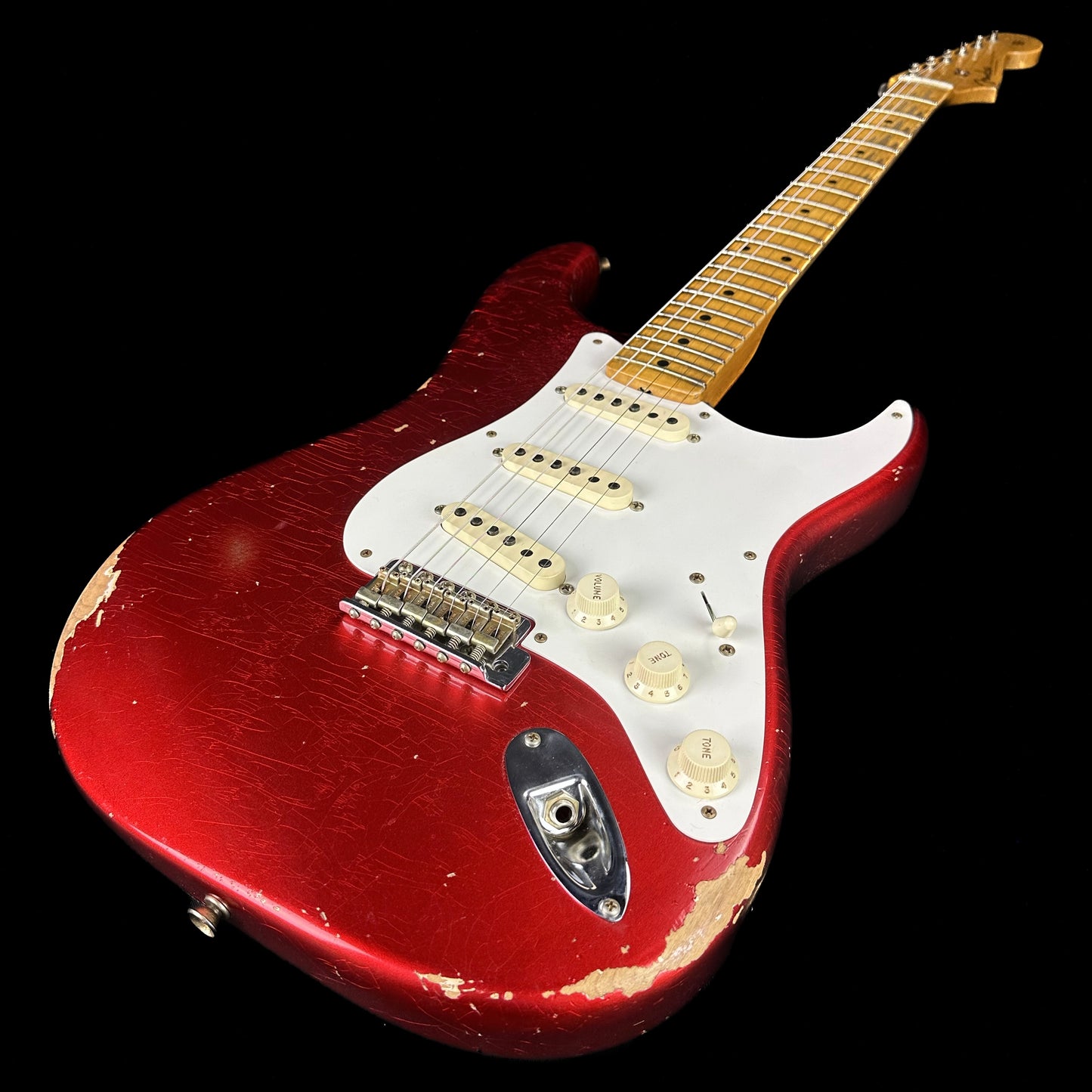 Front angle of Fender Custom Shop 58 Strat Relic Faded Aged Candy Apple Red.