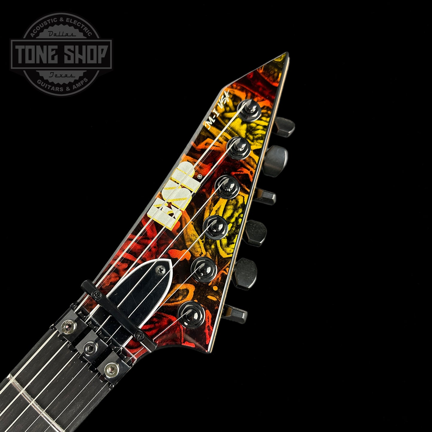 Front of headstock of ESP USA M1 NTB FR Hellfire.