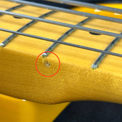 Damage on side of neck of Used Fender CIJ '51 Precision Bass.