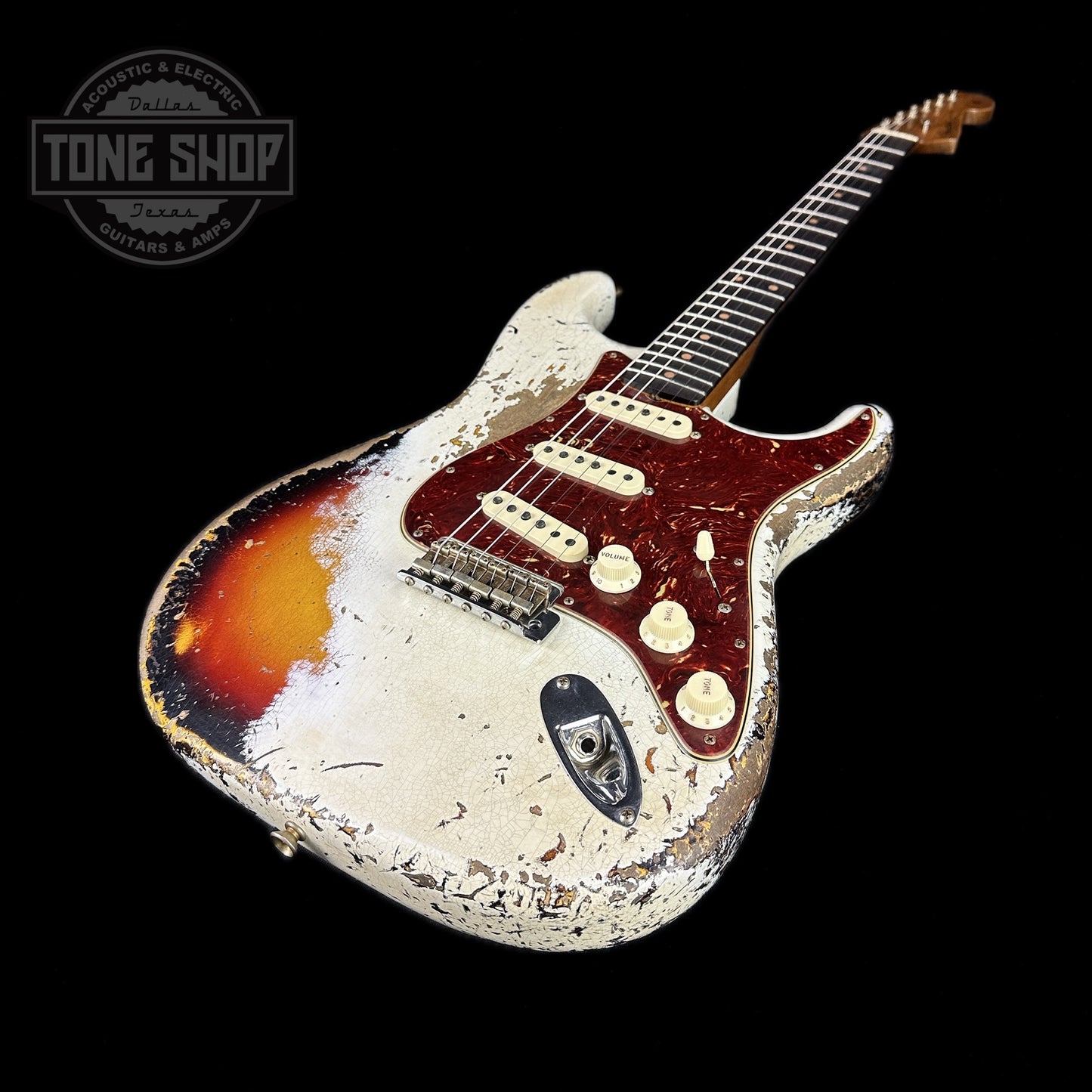 Front angle of Fender Custom Shop Limited Edition Roasted '60 Strat Super Heavy Relic Aged Olympic White Over 3 Color Sunburst.