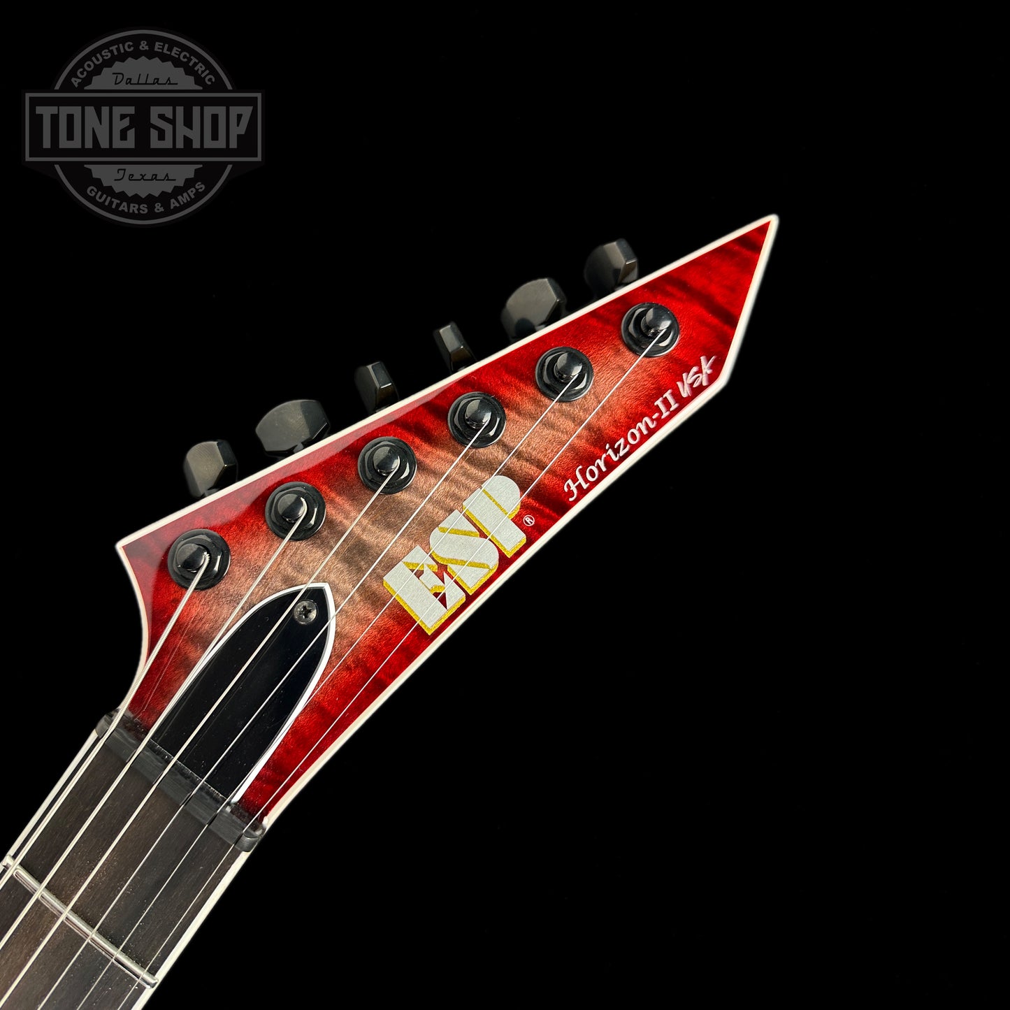 Front of headstock of ESP USA Horizon-II Flame Maple Blood Moon.