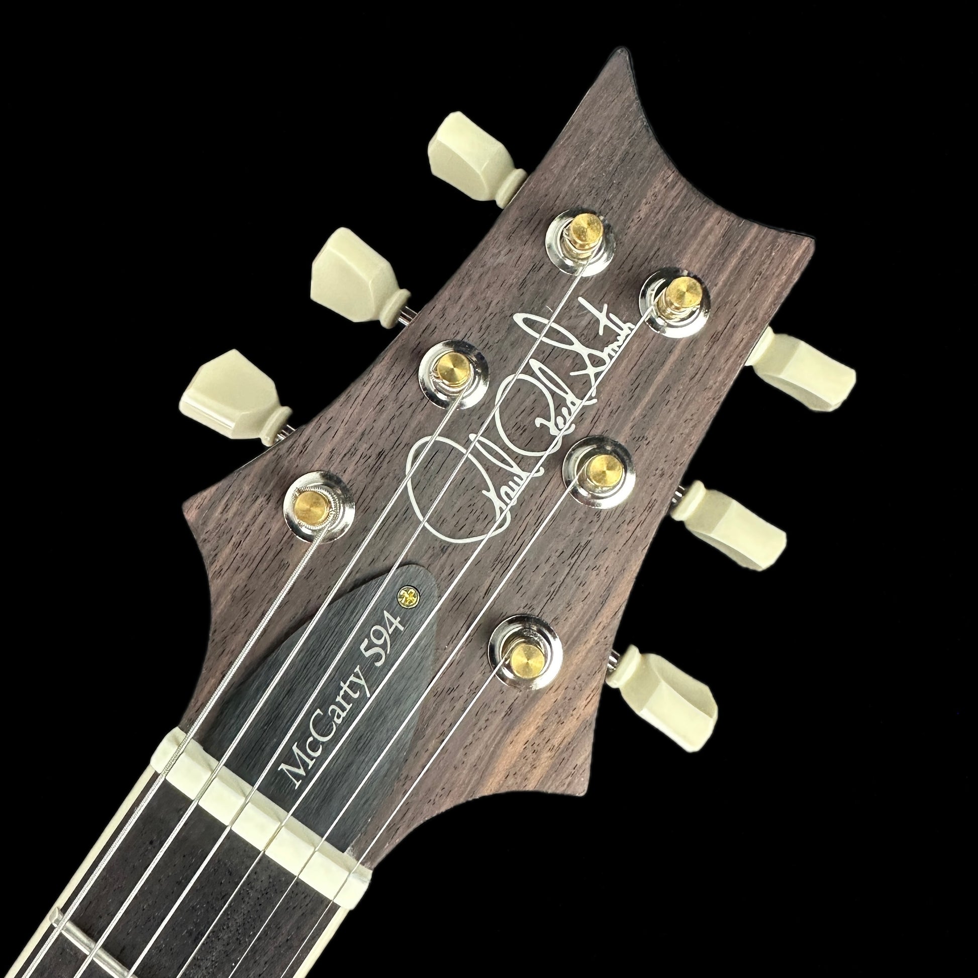 Front of headstock of PRS McCarty 594 Black Gold.