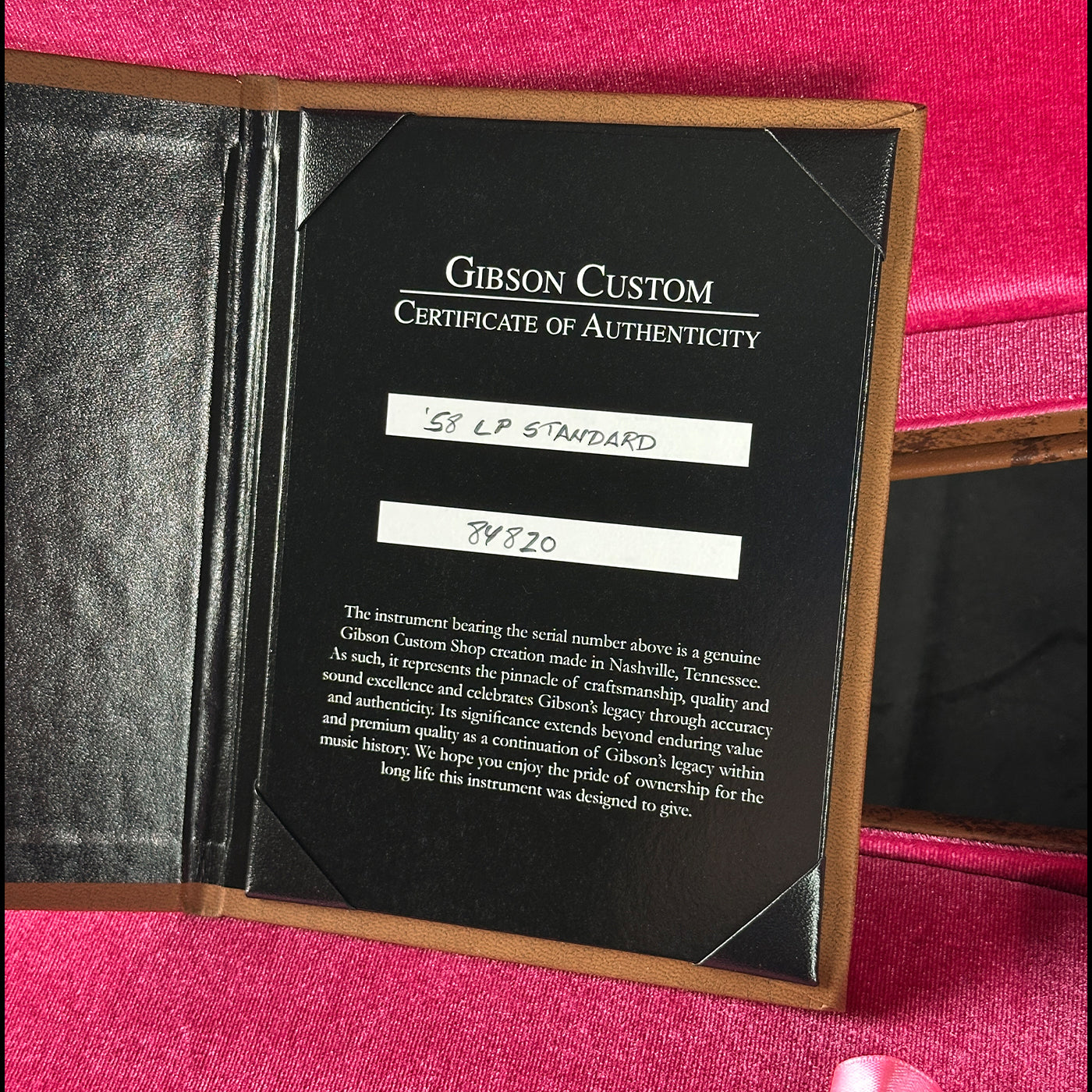 Gibson Custom Certificate of Authenticity on a pink background