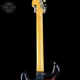 Electric guitar neck and headstock on a black background with 'Tone Shop' logo.
