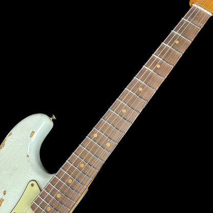 Closeup of Fender Custom Shop 1961 Strat Heavy Relic Super Faded Aged Sonic Blue/3-Color Sunburst fretboard.