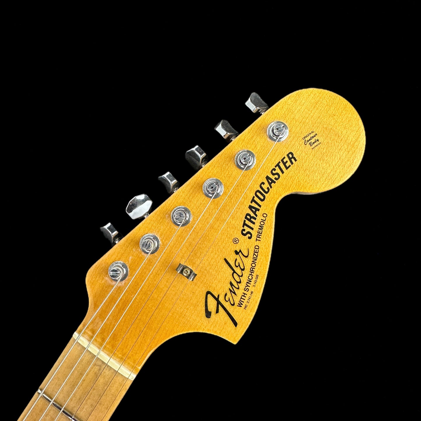 Front of headstock of Fender Custom Shop Limited Edition '69 Strat Journeyman Relic Aged Black.