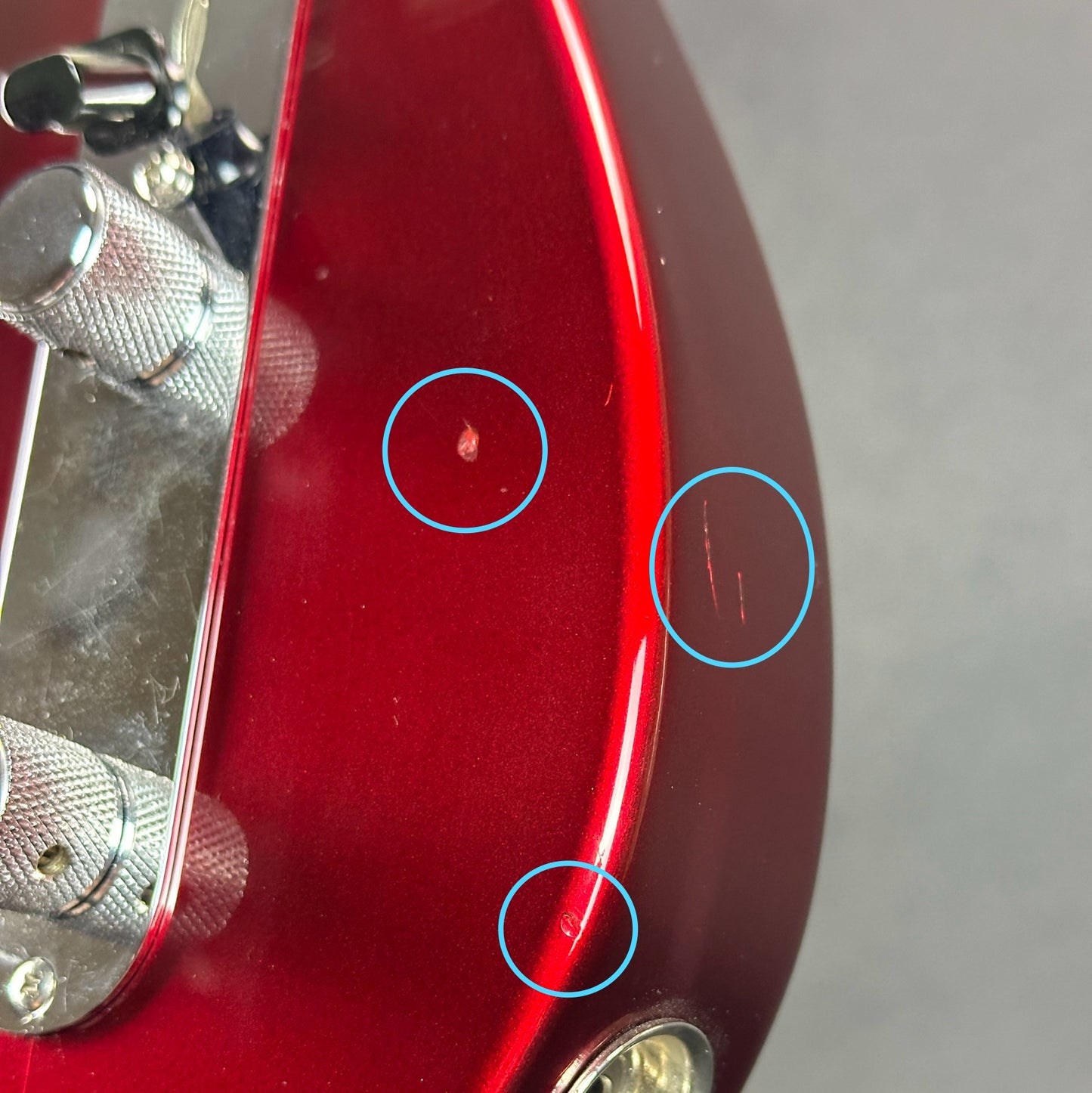 Damage near output jack of Used 2000 Fender Custom Shop 63 Telecaster NOS Candy Apple Red.