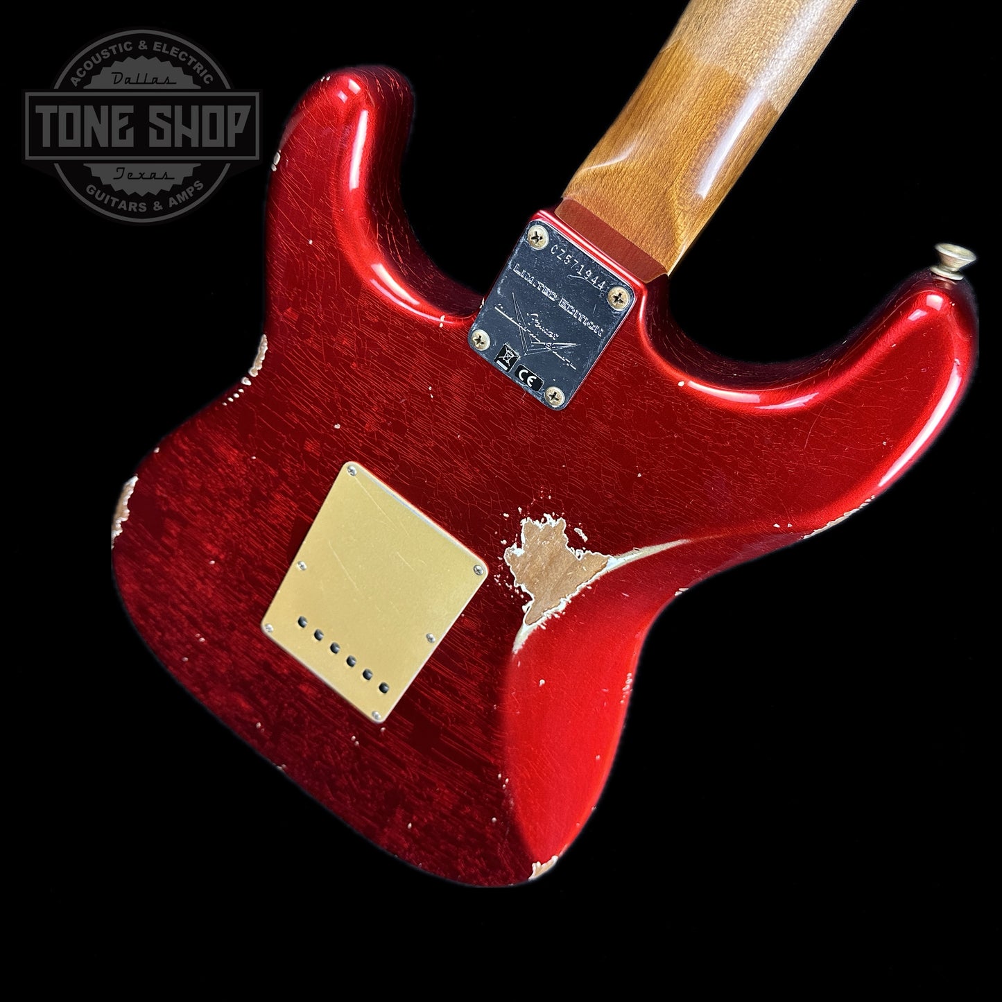 Back angle of Fender Custom Shop 2023 Collection Ltd Roasted Big Head Strat Relic Aged Candy Apple Red.