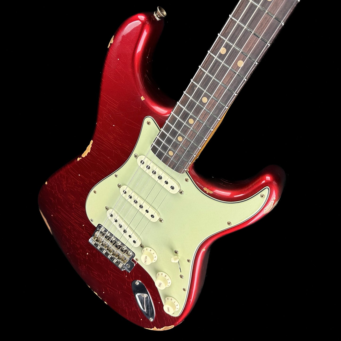 Front angle of Fender Custom Shop Limited Edition '63 Strat Relic Aged Candy Apple Red.