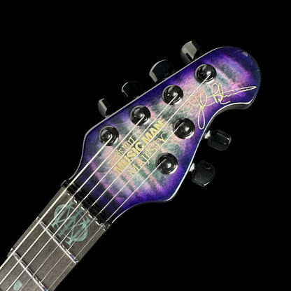 Front of headstock of Ernie Ball MusicMan Majesty 6 Limited Crystal Amethyst.