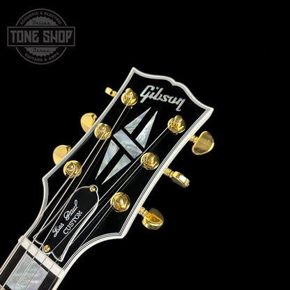 Front of headstock of Gibson Custom Shop Les Paul Custom Alpine White w/ Ebony Fingerboard Gloss.