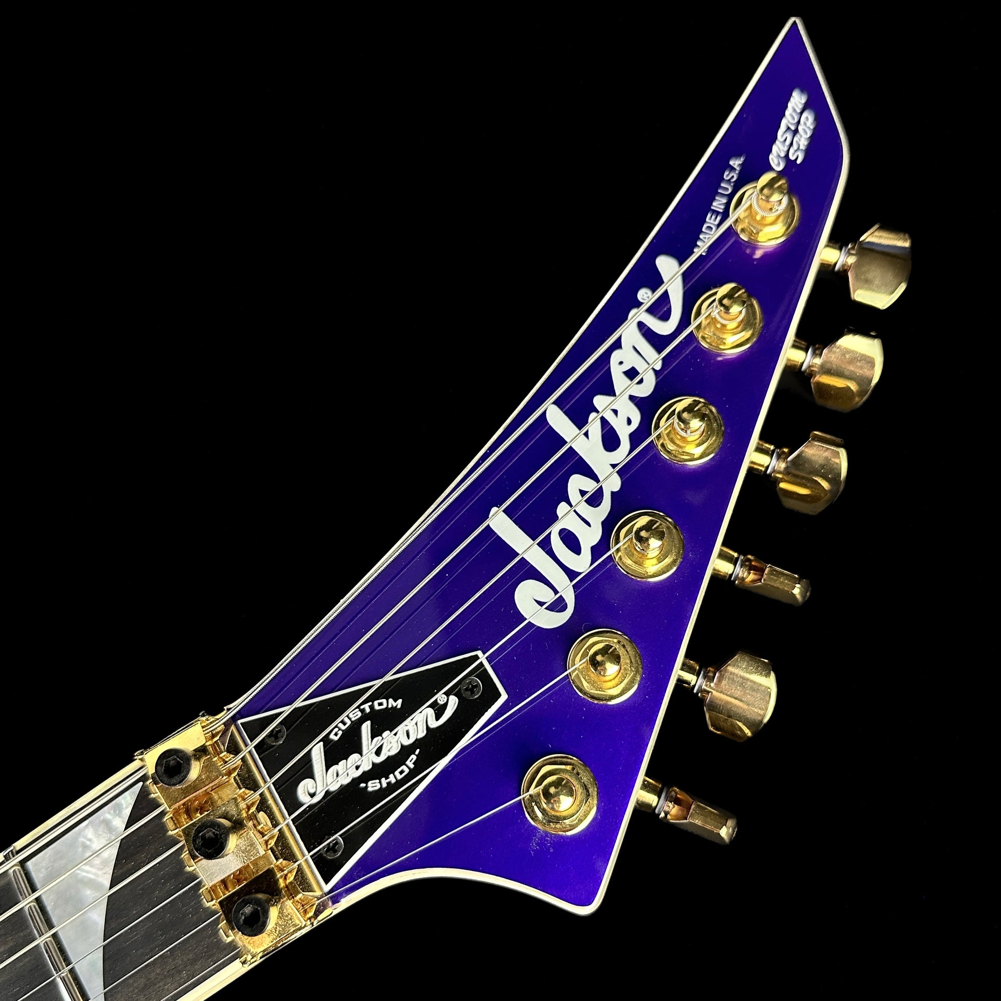 Front of headstock of Jackson Custom Shop SL 2H Floyd Rose Purple Metallic