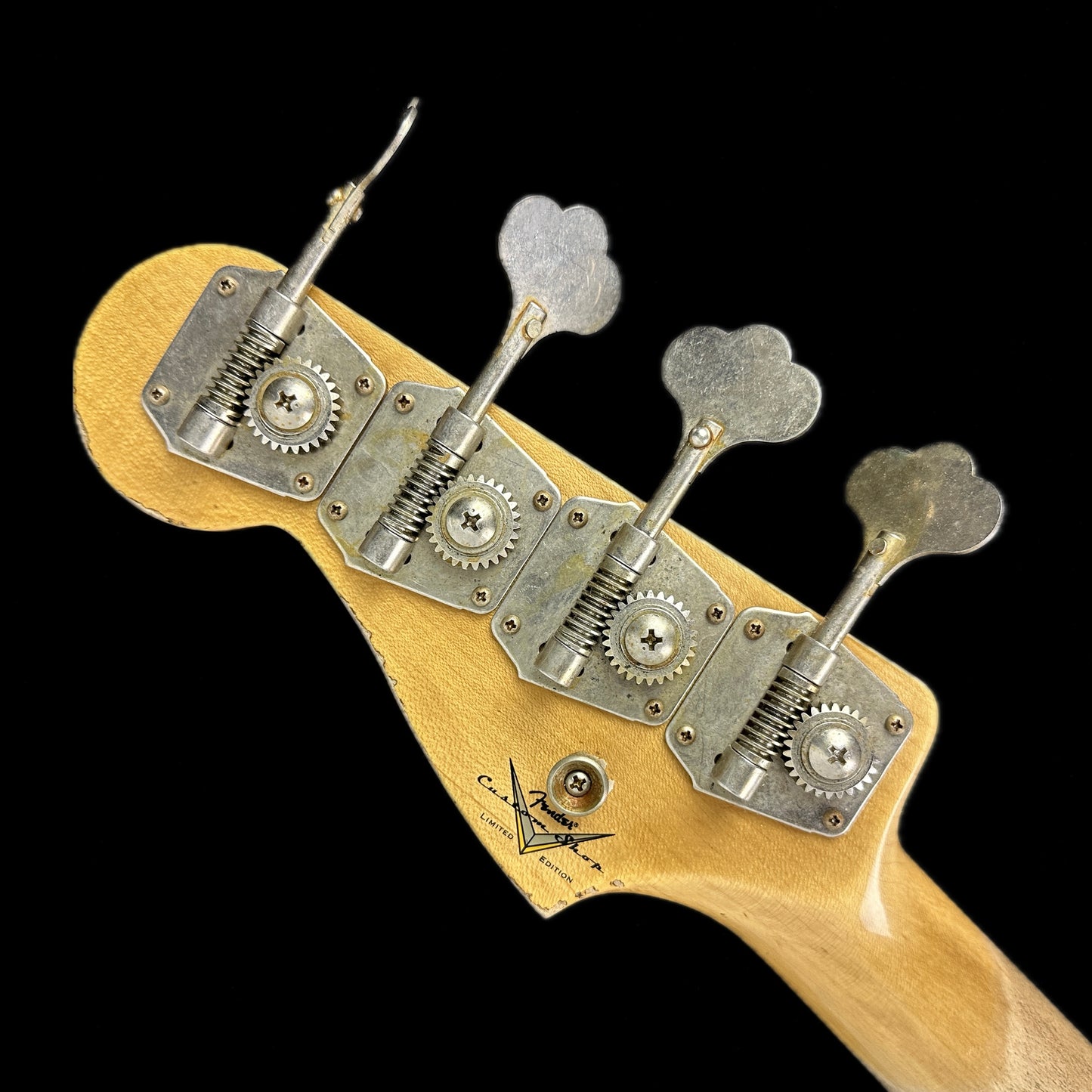 Back of headstock of Fender Custom Shop Limited Edition '63 Precision Bass Heavy Relic Faded Aged 3 Color Sunburst.