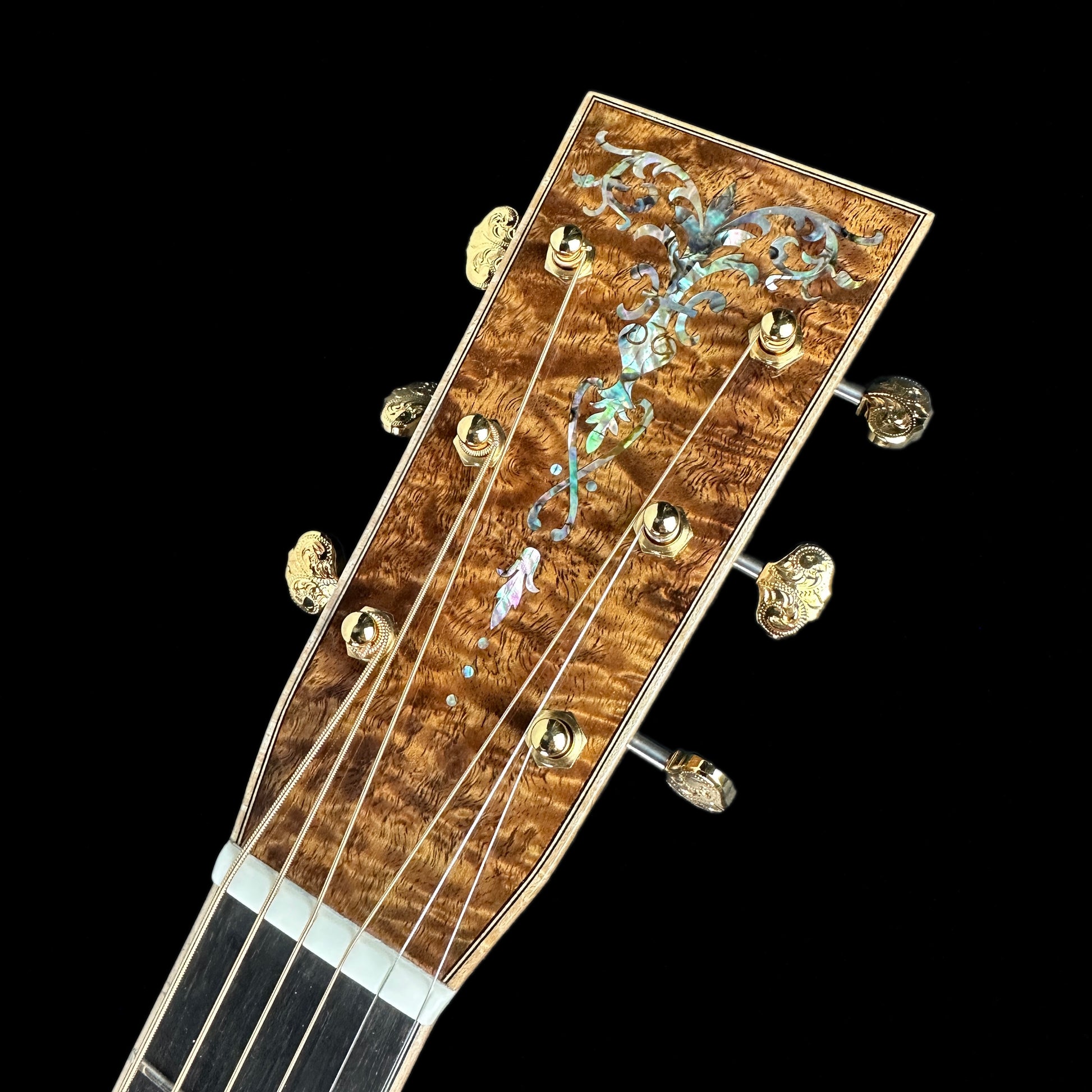 Front of headstock of Martin Custom Shop 42 Style Dread All Exceptional Figured Koa.