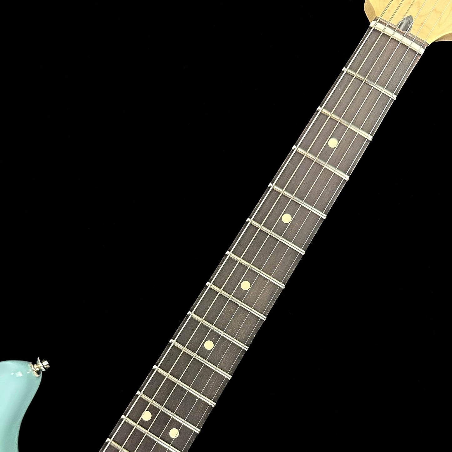 Fretboard of Used Fender Limited Edition Tom Delonge Stratocaster Daphne Blue.