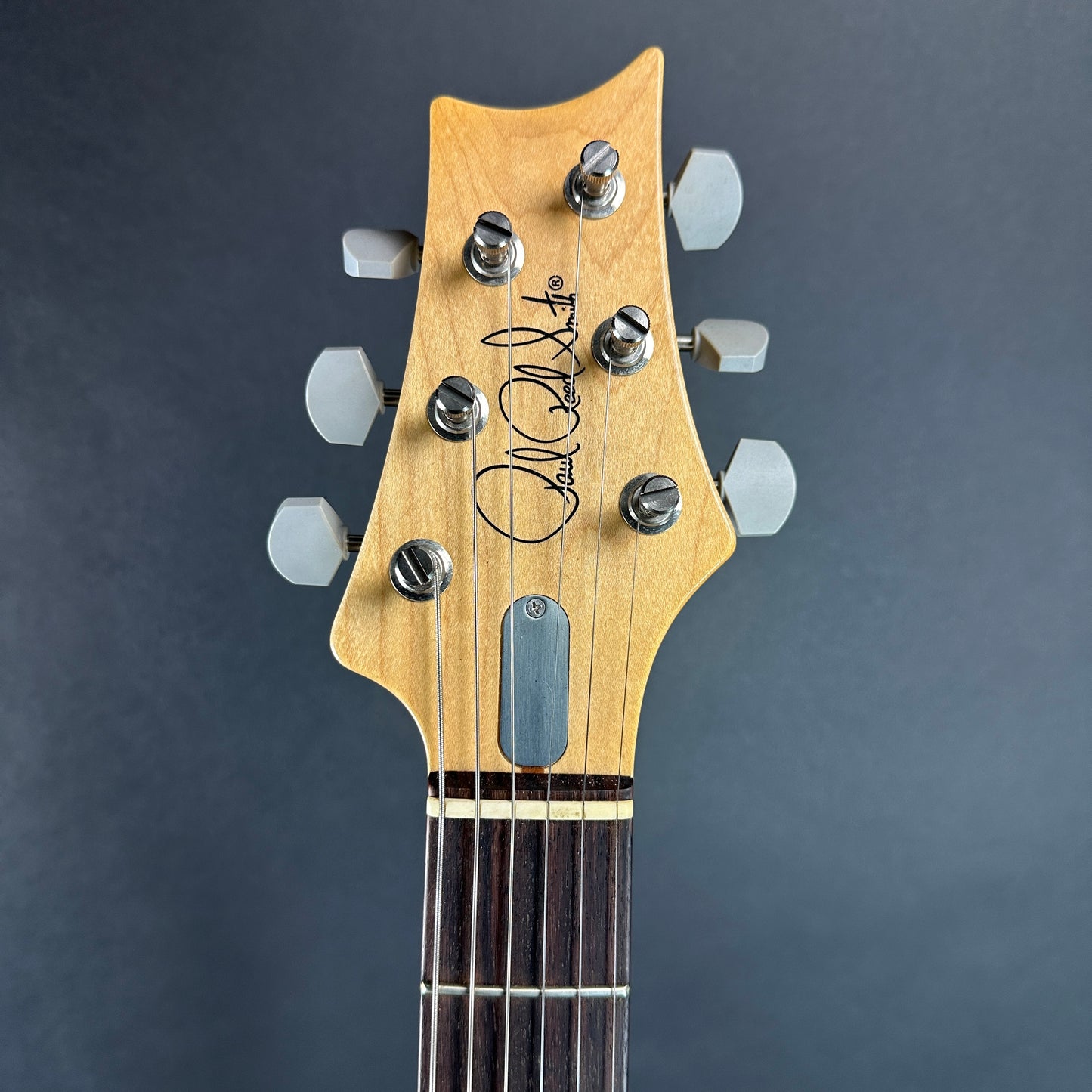 Front of headstock of Used 2019 PRS Silver Sky Grey.