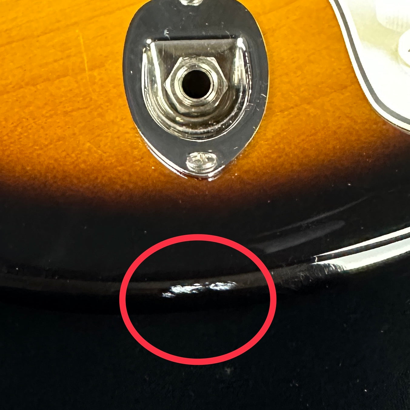 Scratch near output jack of Used Fender Parallel Universe Stratocaster Telecaster Hybrid.