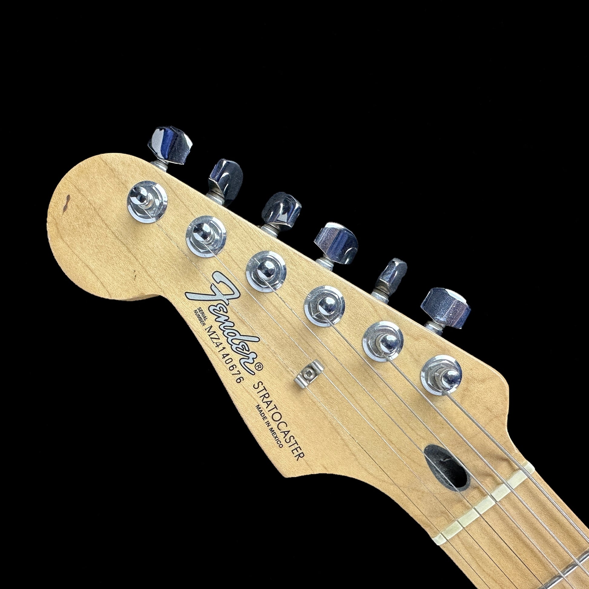 Front of headstock of Used Fender Standard Stratocaster Left Hand Burgundy.