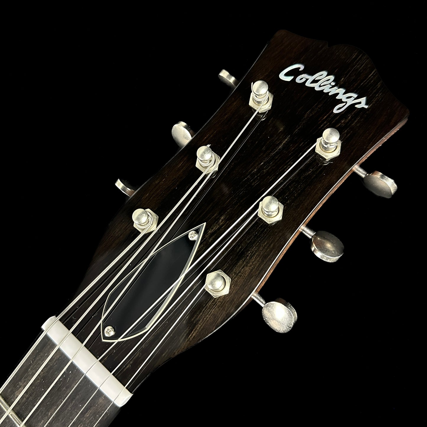 Front of headstock of Collings 470 JL Antiqued Black.