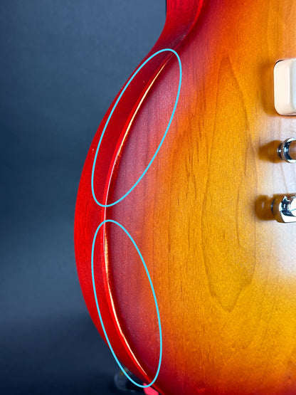 Wear on side of Used Gibson Tribute Les Paul P90 Sunburst.