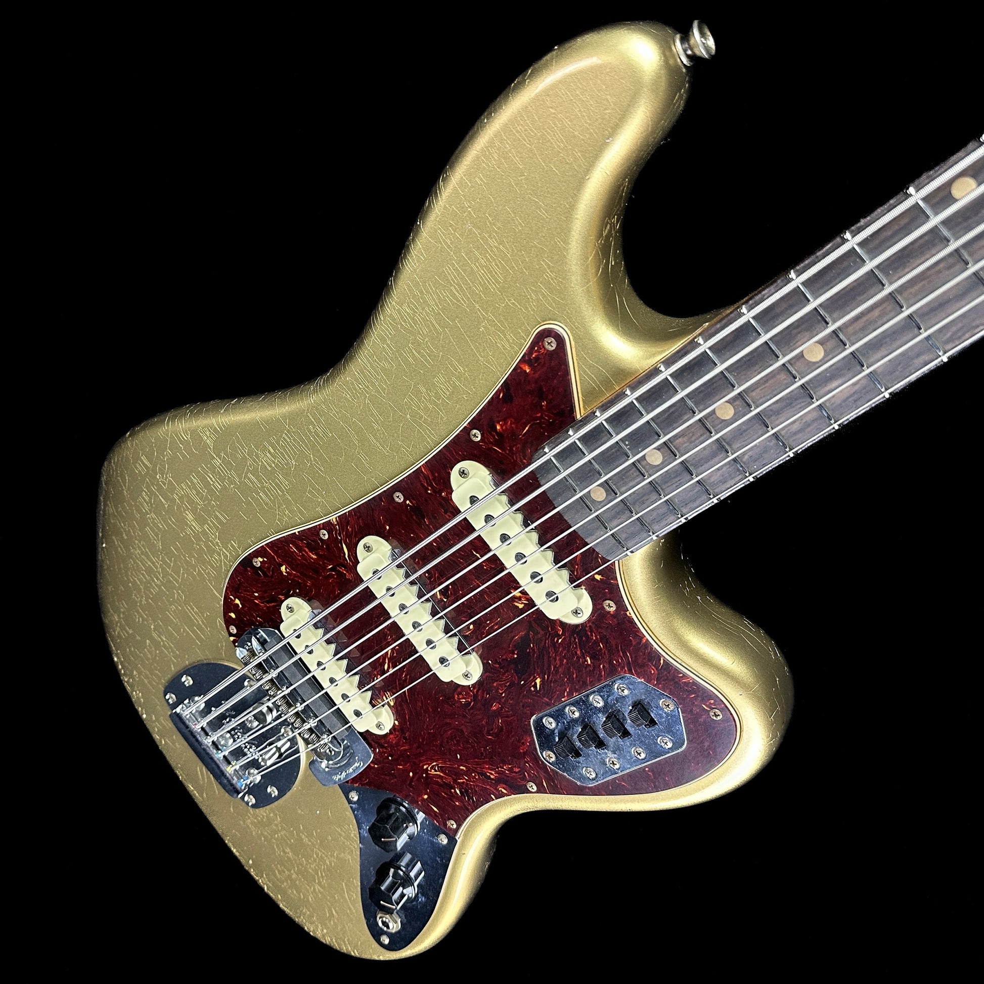 Front angle of Fender Custom Shop Limited Edition Bass VI Journeyman Relic Aged Aztec Gold.