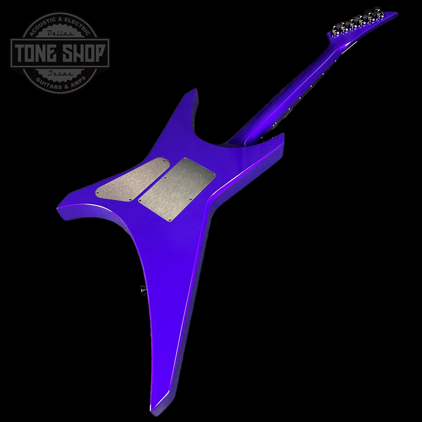 Back angle of Jackson Custom Shop Limited Edition Warrior NOS Purple Metallic.