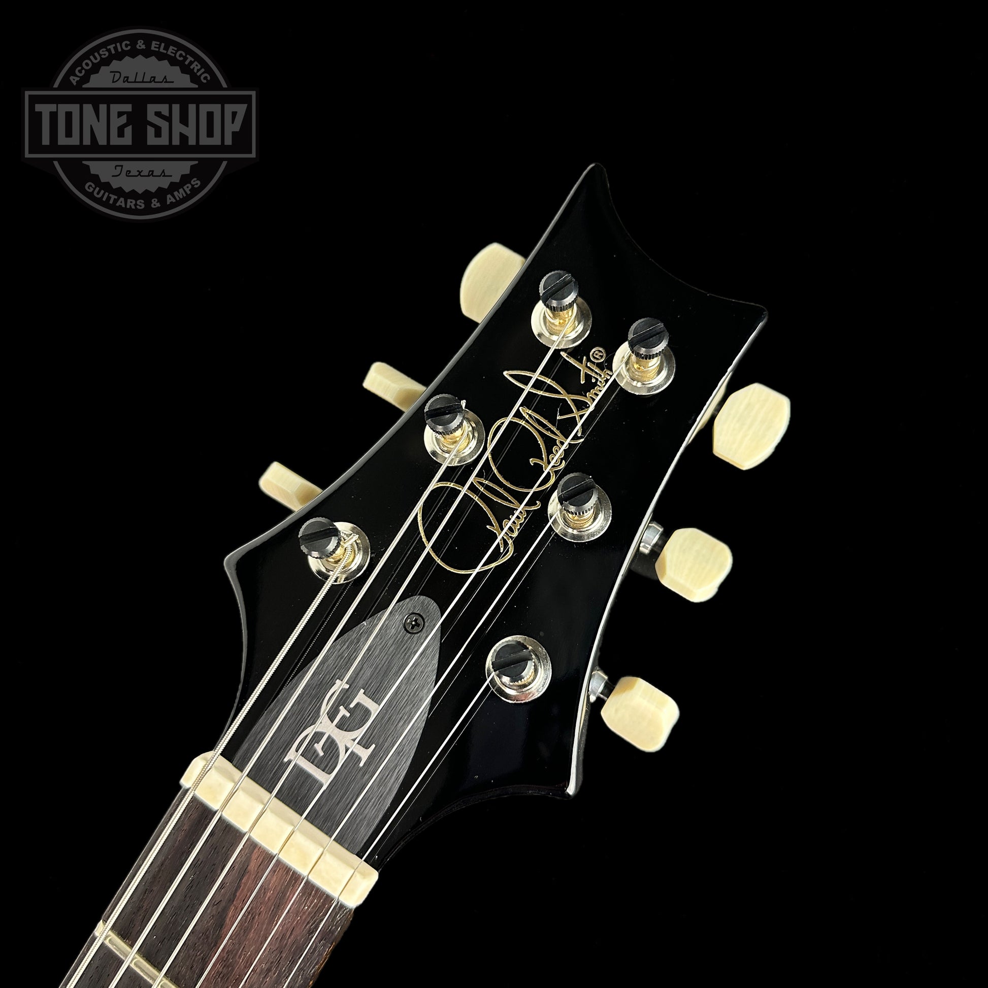 Front of headstock of PRS DGT David Grissom Trem 10 Top Purple Mist Birds.