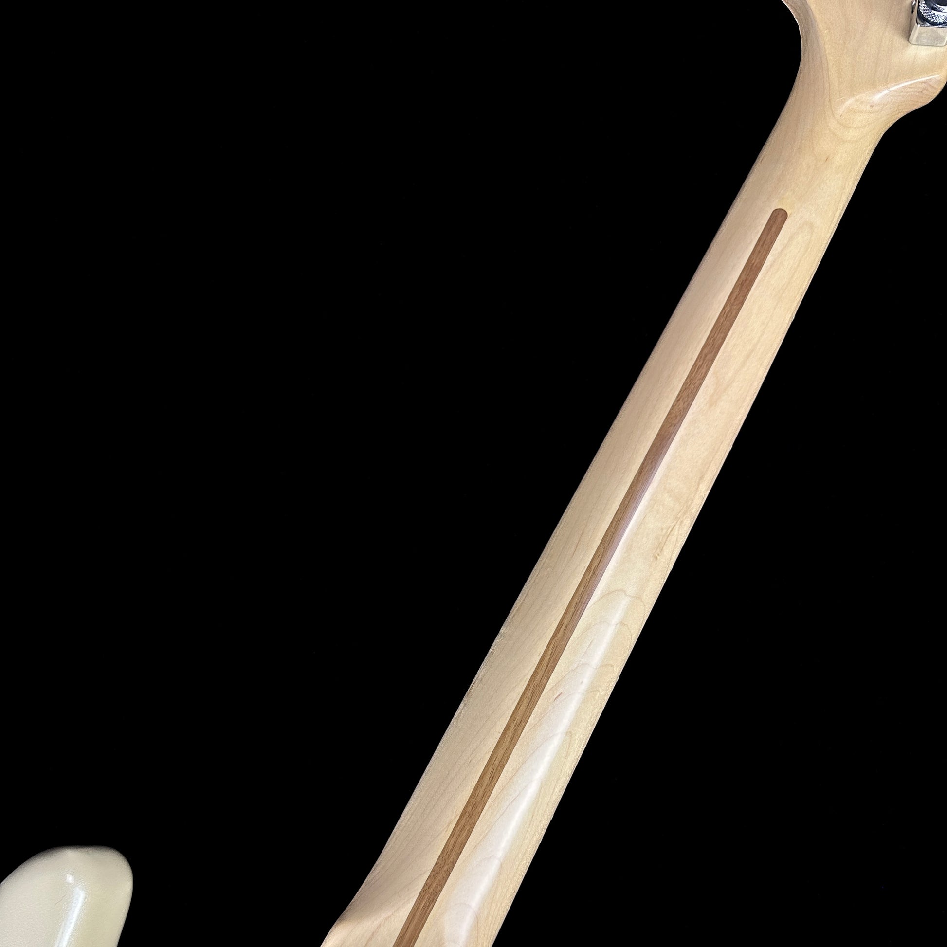 Back of neck of Used 2006 Fender American Deluxe Stratocaster HSS Olympic White.