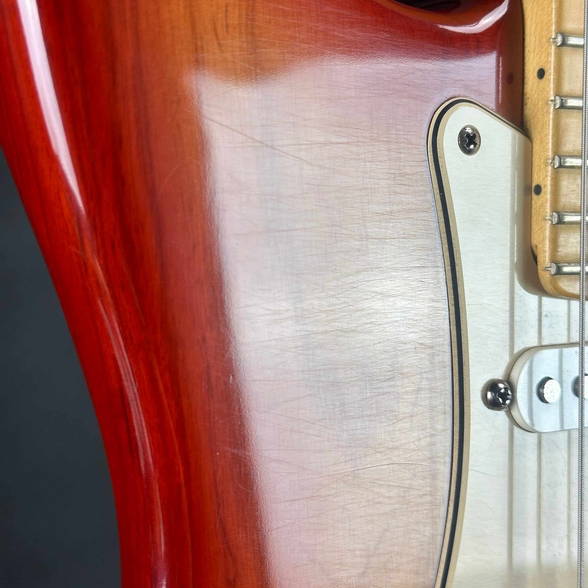 Scratches near pickguard of Used Fender American Standard Strat Sienna MP.