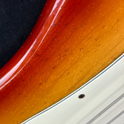 Damage on side of Used 1983 Fender Elite Precision Bass II Sienna Burst.