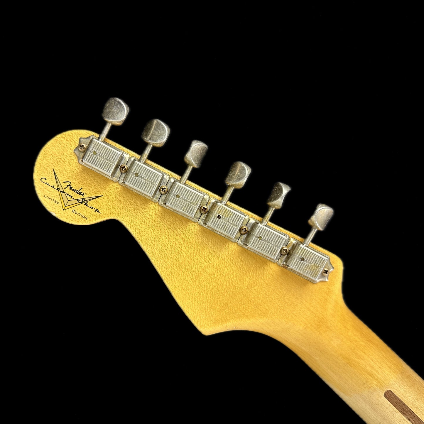 Back of headstock of Fender Custom Shop LTD 70th Anniversary 1954 Stratocaster Relic 2-Color Sunburst.